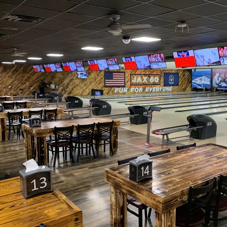 Numbered dining tables beside the bowling lanes at Jax 60 in Jackson, Michigan