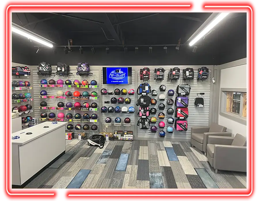Andy's Pro shop interior with bowling balls, bags, and seating at Jax 60 in Jackson, Michigan